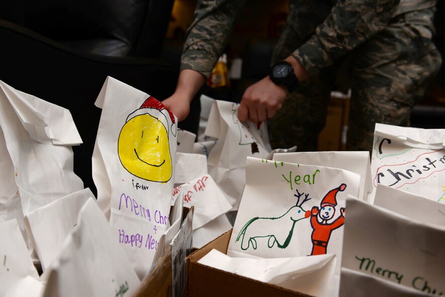 Bags of cookies filled Hangar 1 at the Sheppard Club as they waited to be picked up by the Military Training Leaders who would later pass them out to the Airmen. (U.S. Air Force photo/2nd Lt. Brittany Curry)