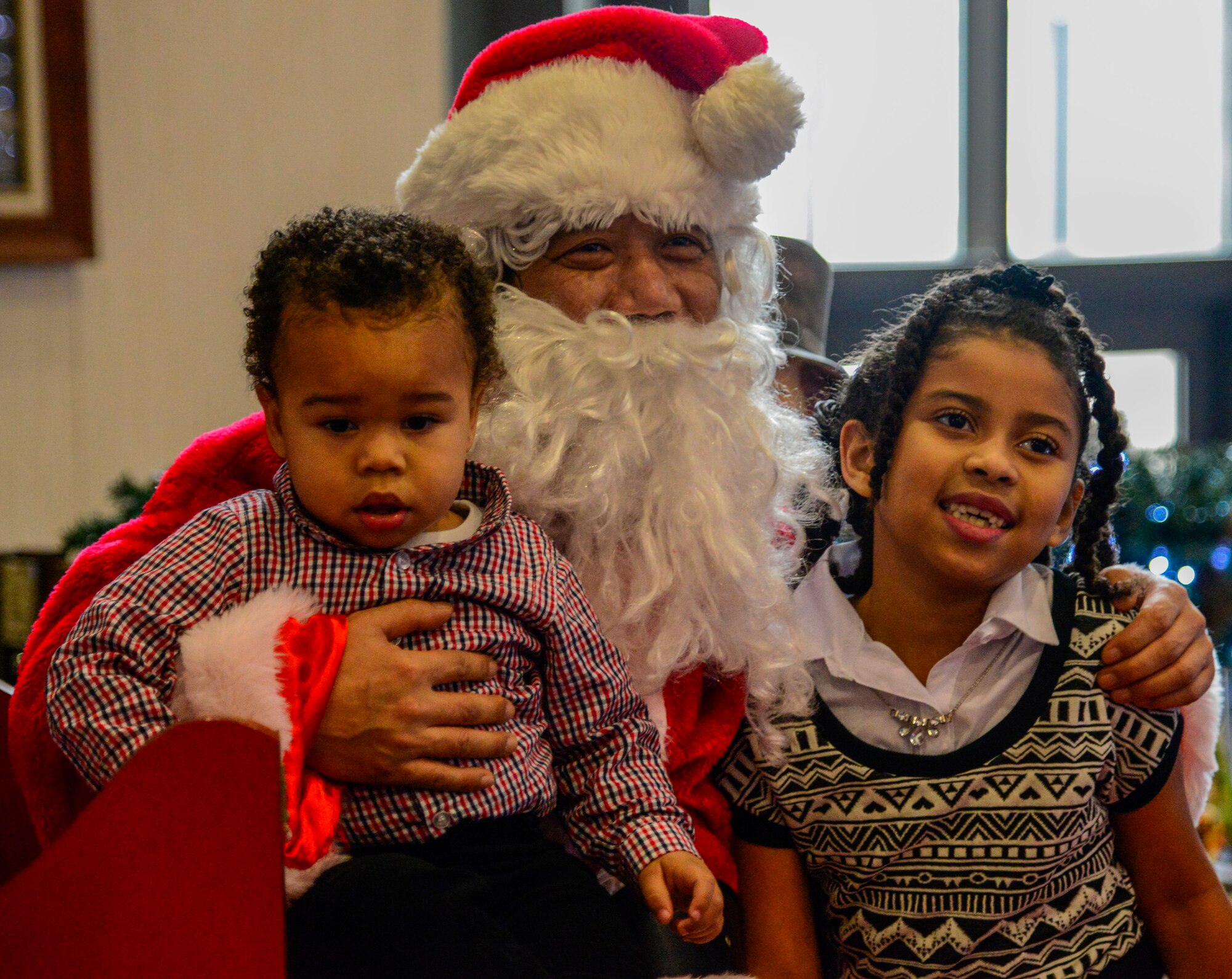 Children take a picture with Santa during the 51st Force Support Squadron’s “Brunch with Santa” on Osan Air Base, Republic of Korea, Dec. 20, 2015. More than 200 Team Osan members attended the annual holiday brunch at the Officer’s Club. (U.S. Air Force photo/Senior Airman Kristin High)