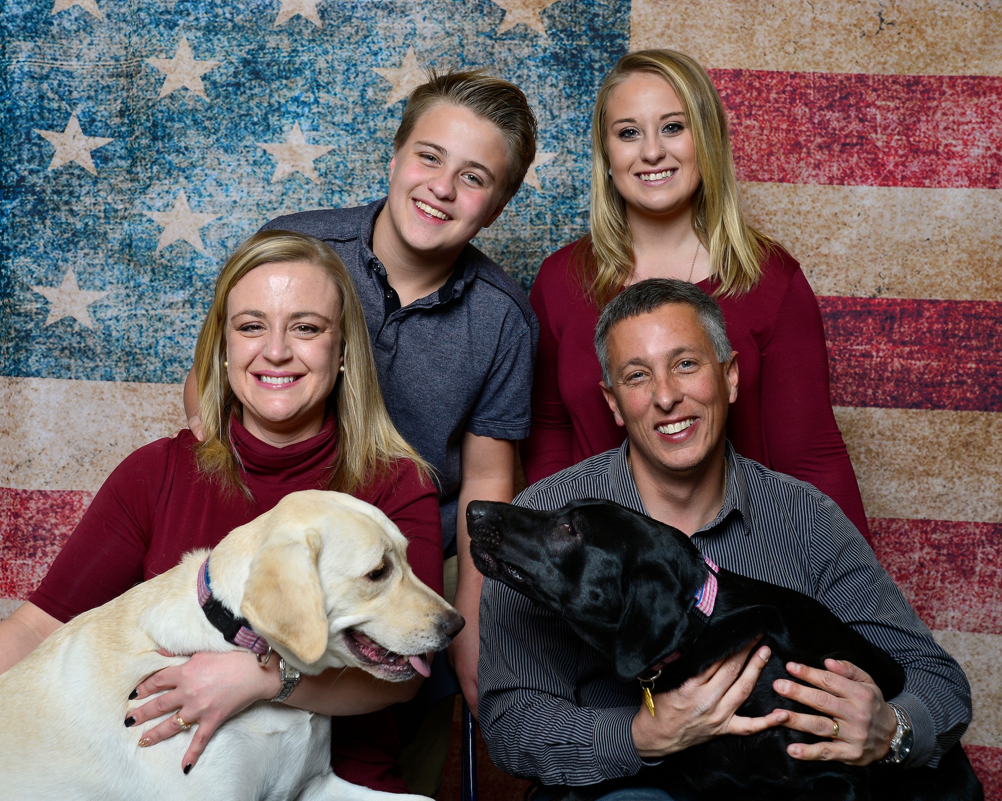 A Creech Air Force Base family poses for a photo during the first Creech Family Photo Day, Dec. 19, 2015 in Las Vegas, Nevada. The photo day provided an opportunity for Creech members to bring their families and pets to a location where they could receive free family photos for the holidays. (U.S. Air Force photo by Tech. Sgt. Nadine Barclay)