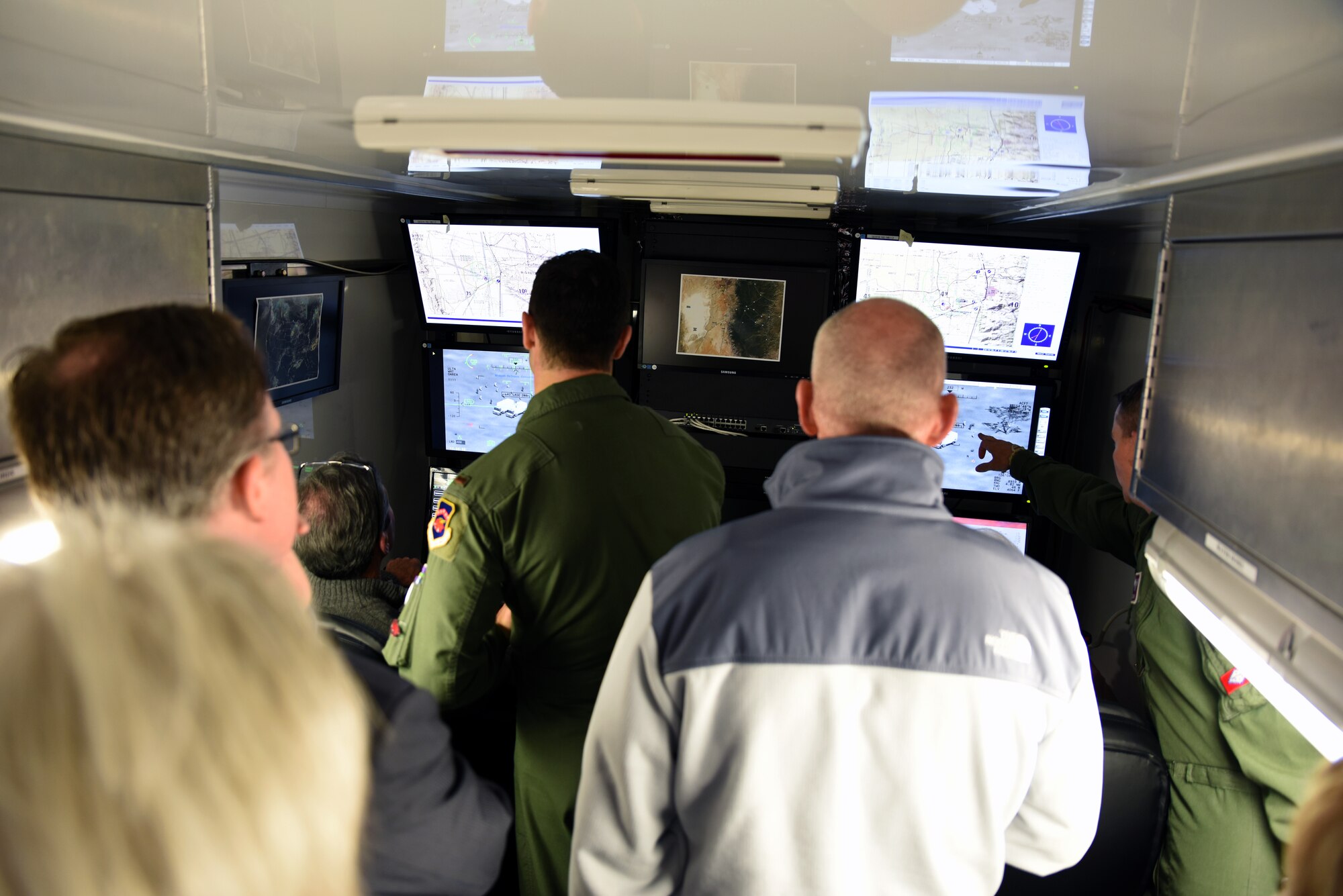 Members of the 188th Wing provide a demonstration Dec. 18, 2015 to the Arvest Bank local senior management team and the regional board of directors on the predator reaper integrated mission environment (PRIME) trainer at Ebbing Air National Guard Base, Fort Smith, Ark. The PRIME is a flight simulator that gives remotely piloted aircraft operators the opportunity to hone their skills during simulated missions. (U.S. Air National Guard photo by Senior Airman Cody Martin/Released)