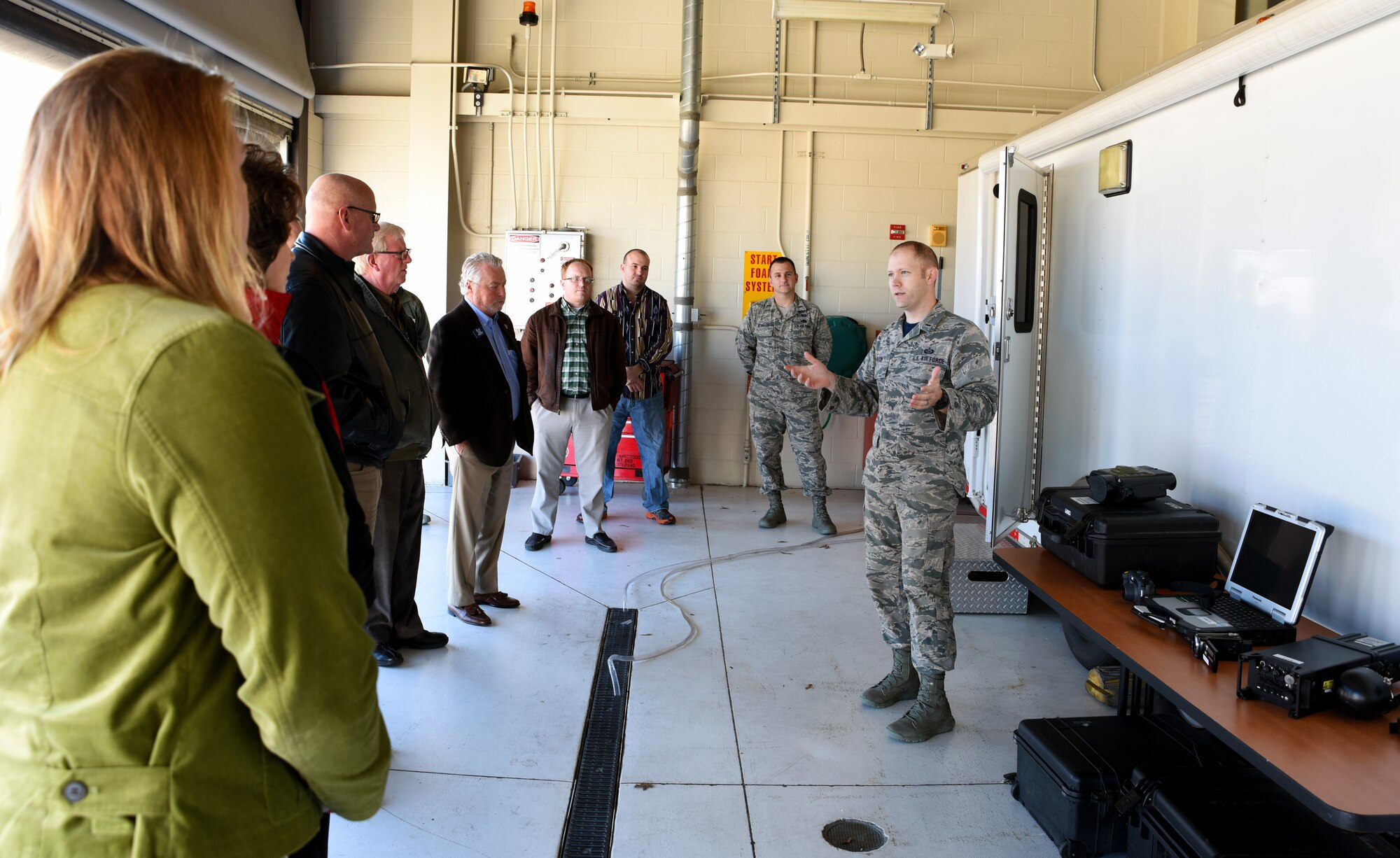 2nd Lt. Samuel Hardin, 188th Intelligence, Surveillance and Reconnaissance Group intelligence officer, describes the capabilities of the remote air, zonal operations, reach back-processing, assessment and dissemination (RAZORBack PAD) Dec. 18, 2015 to the Arvest Bank local senior management team and the regional board of directors at Ebbing Air National Guard Base, Fort Smith, Ark. The RAZORBack PAD can assist disaster workers on the ground with video from overhead aircraft to provide information on areas or people most in need during emergency response planning and operations. (U.S. Air National Guard photo by Senior Airman Cody Martin/Released)