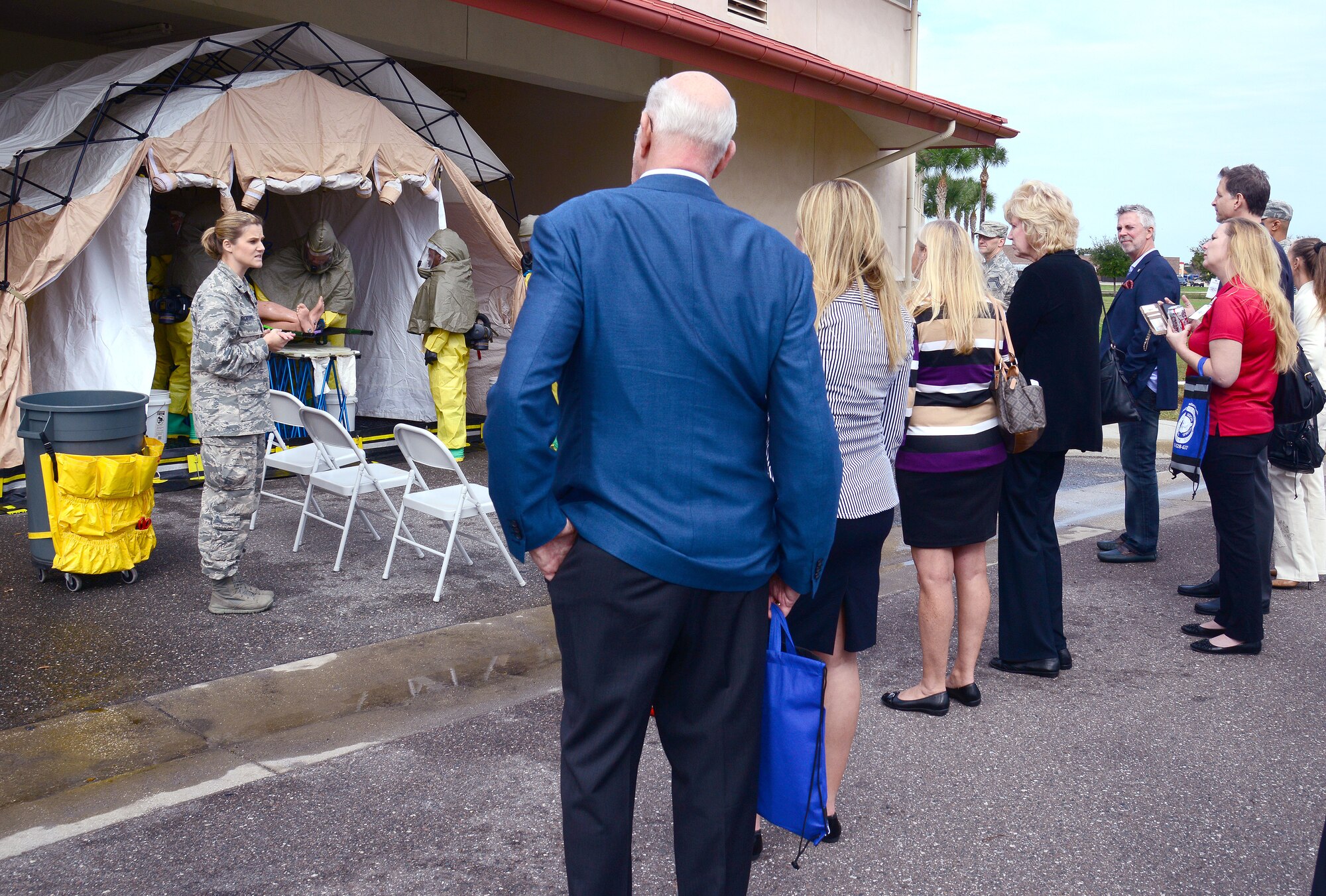 1st Lt. Jessica Robbins, a physician’s assistant assigned to the 6th Medical Operation Squadron, explains the process of setting up a decontamination tent to a group of honorary commanders during an immersion tour at the 6th Medical Group at MacDill Air Force Base, Fla., Dec. 18, 2015. During their visit to the 6th MDG, honorary commanders were given a mission brief by the 6th Air Mobility Wing commander, 927th Air Refueling Wing commander, and 6th MDG commander, along with viewing the work sections from several flights around the group. (U.S. Air Force photo by Staff Sgt. Brittany Liddon)
