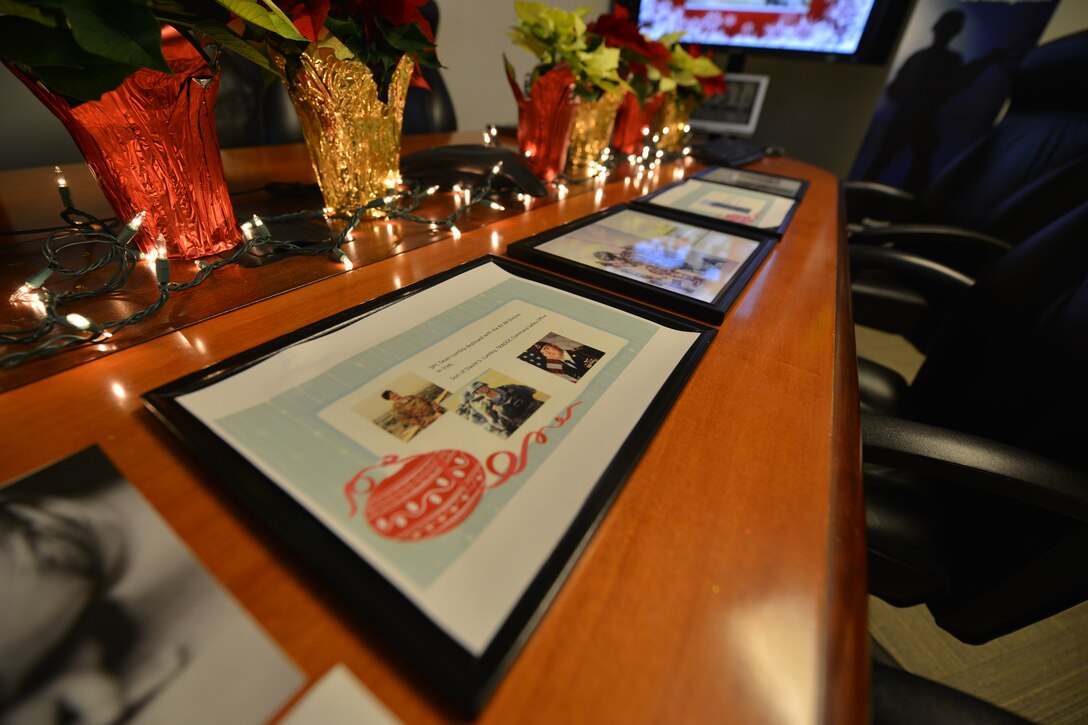 Members of U.S. Army Training and Doctrine Command’s (TRADOC) Architecture Integration Management Directorate decorated a deployment holiday room at Fort Eustis, Va., Dec. 21, 2015. The directorate set up the room to honor and remember members throughout TRADOC who are deployed this holiday season. (U.S. Air Force photo by Staff Sgt. Natasha Stannard)