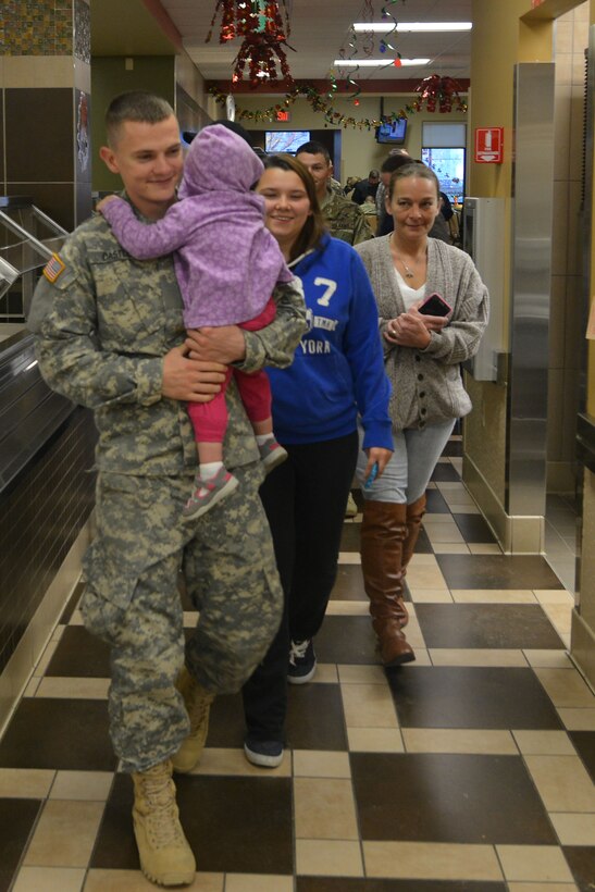 Advanced Individual Training students  assigned to the 128th Aviation Brigade meet with their families for exodus at Fort Eustis, Va., Dec. 18, 2015. This was the first opportunity for the students to spend time with their friends and family since graduating basic training. (U.S. Air Force photo by Staff Sgt. Natasha Stannard)