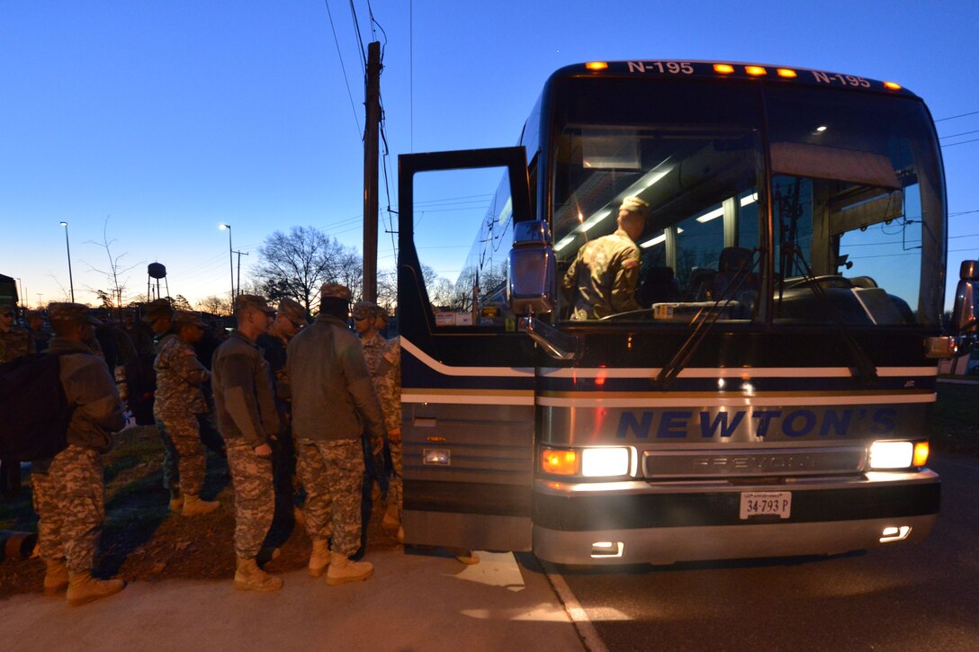 Advanced Individual Training students  assigned to the 128th Aviation Brigade board a bus at Fort Eustis, Va., Dec. 18, 2015. Buses transported the students to local airports and train stations. (U.S. Air Force photo by Staff Sgt. Natasha Stannard)