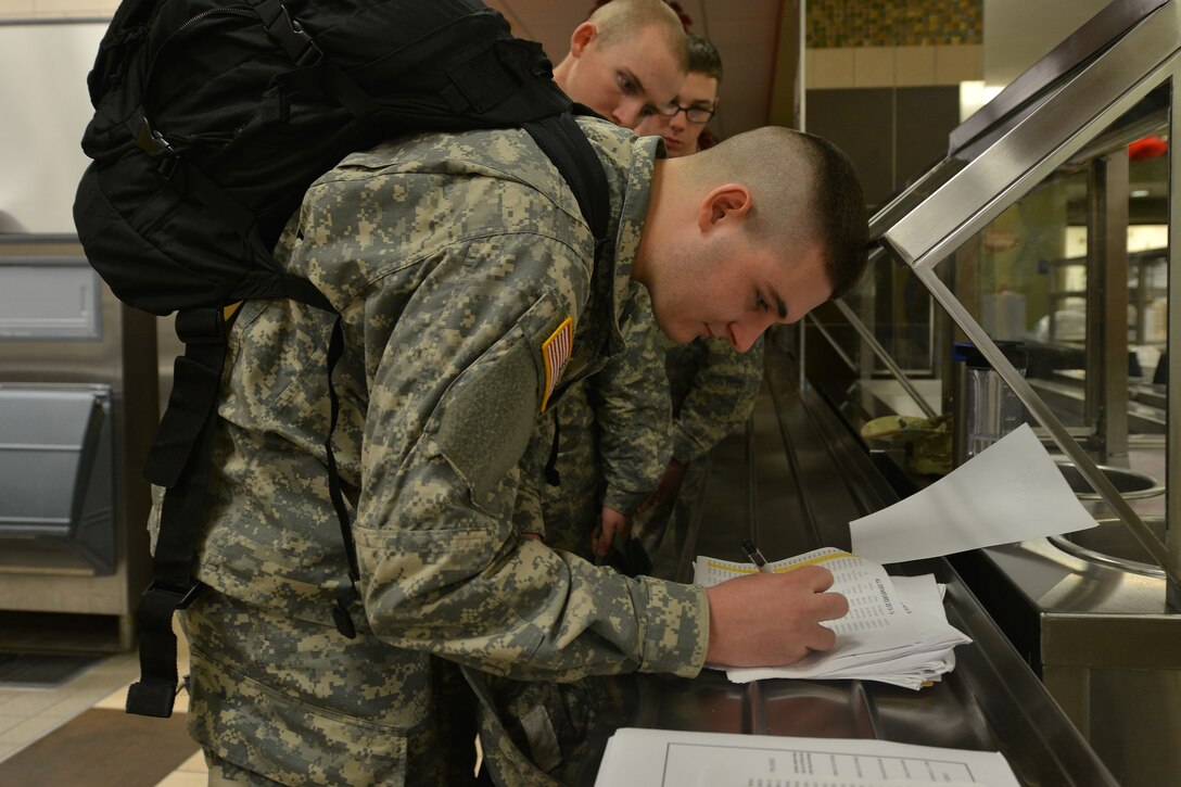 U.S. Army Pvt. Timothy Makara, a student with the 128th Aviation Brigade Advanced Individual Training, who is from Poughkeepsie, N.Y., signs out for exodus at Fort Eustis, Va., Dec. 18, 2015. The students and staff of the 128th Aviation Brigade’s schools were allotted a break  from instruction to take leave during the holidays. (U.S. Air Force photo by Staff Sgt. Natasha Stannard)