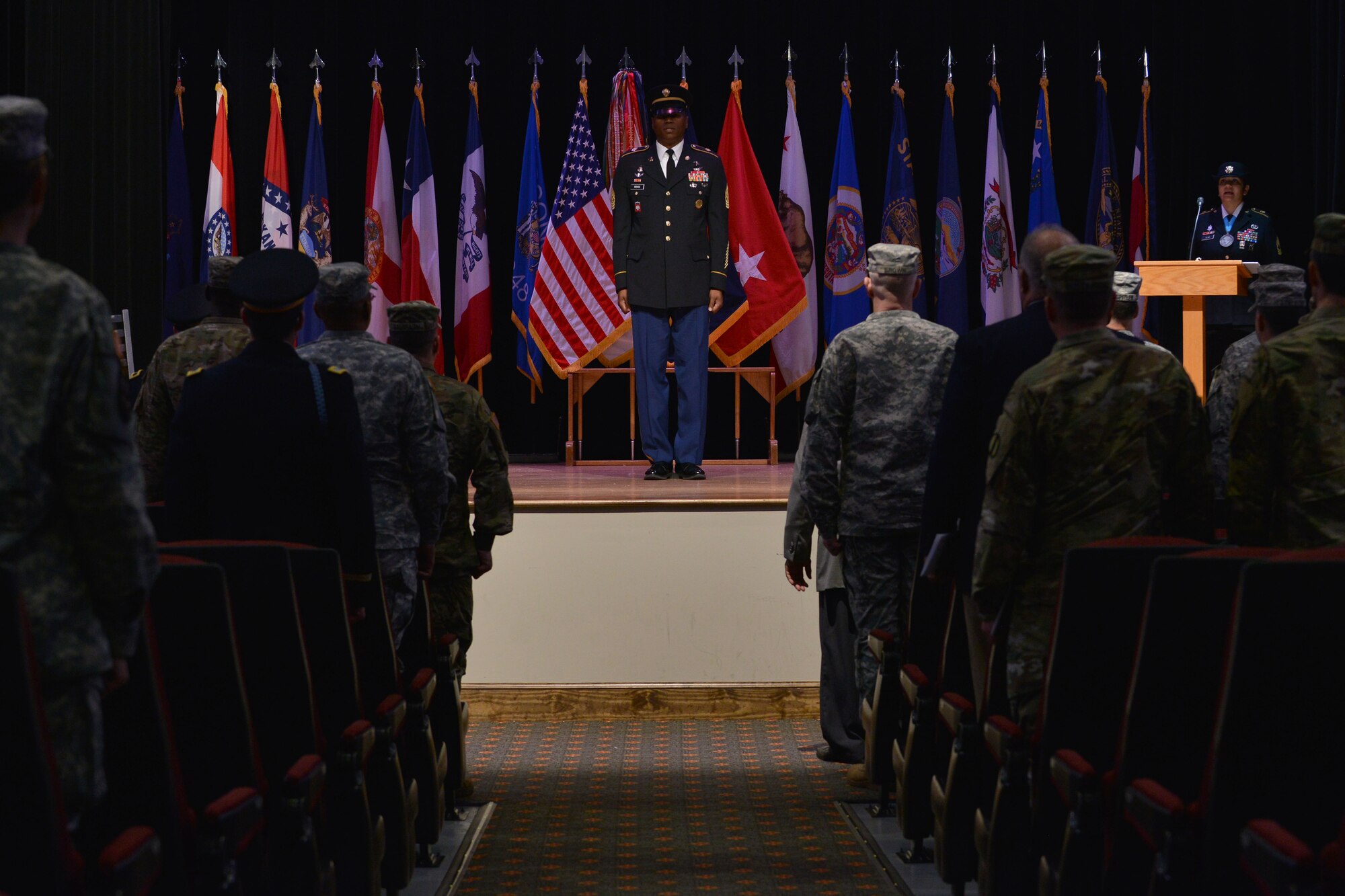 U.S. Army Command Sgt. Maj. Michael L. Gragg, command sergeant major of U.S. Army Training and Doctrine Command Center for Initial Military Training (CIMT), recites the Army song during the CIMT change of responsibility at Fort Eustis, Va., Dec. 16, 2015. Gragg gained responsibility of command during the ceremony, and has previously held command sergeant major positions in the U.S. and overseas. (U.S. Air Force photo by Staff Sgt. Natasha Stannard)