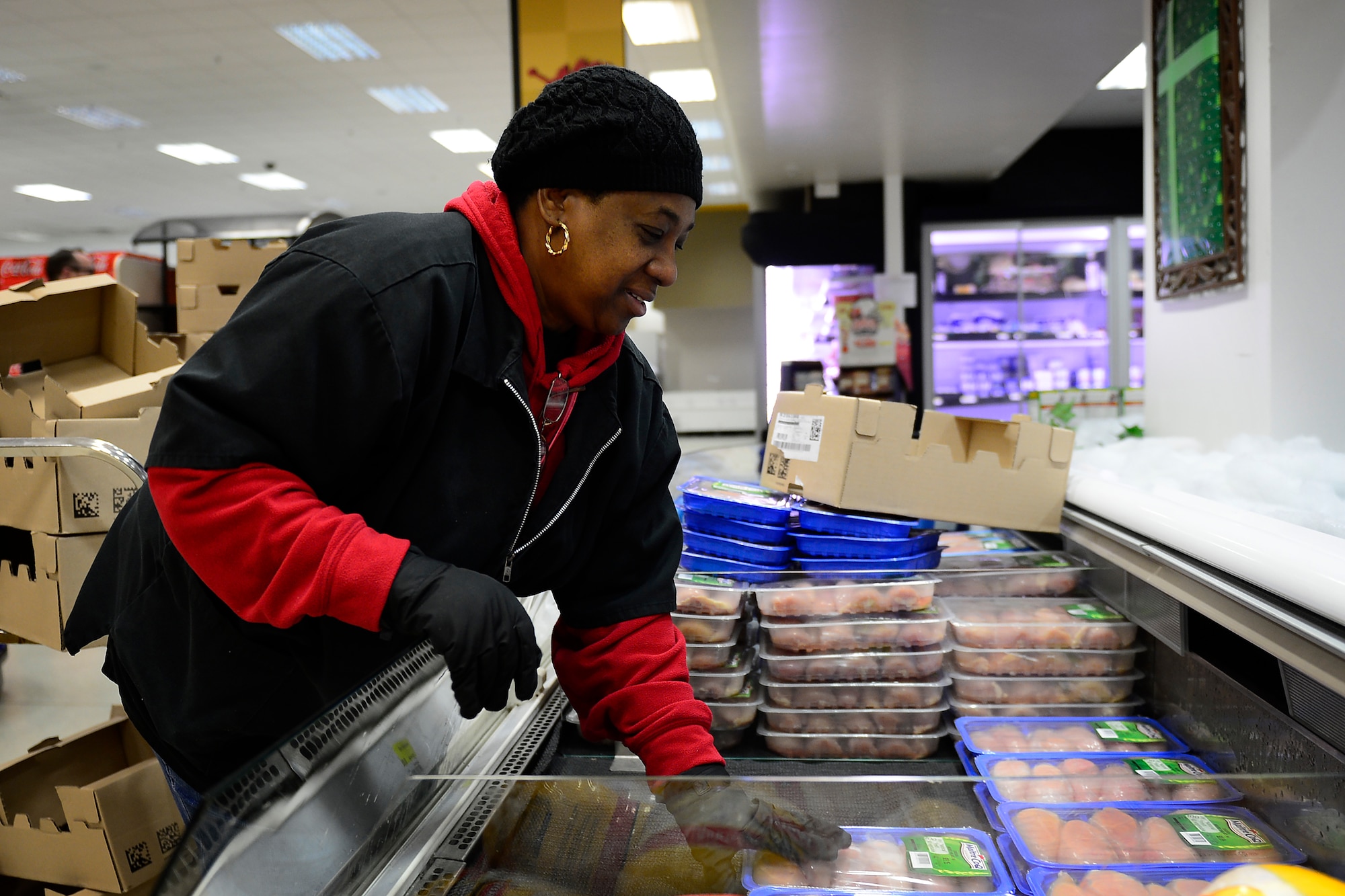 With almost 20 new employees, the staff helps to keep the products rotated and fresh for customers at the commissary at Royal Air Force Lakenheath, England, Dec. 7, 2015. Military personnel save an average of 30 percent or more shopping at the commissary. (U.S. Air Force photo by Airman 1st Class Erin R. Babis/Released)