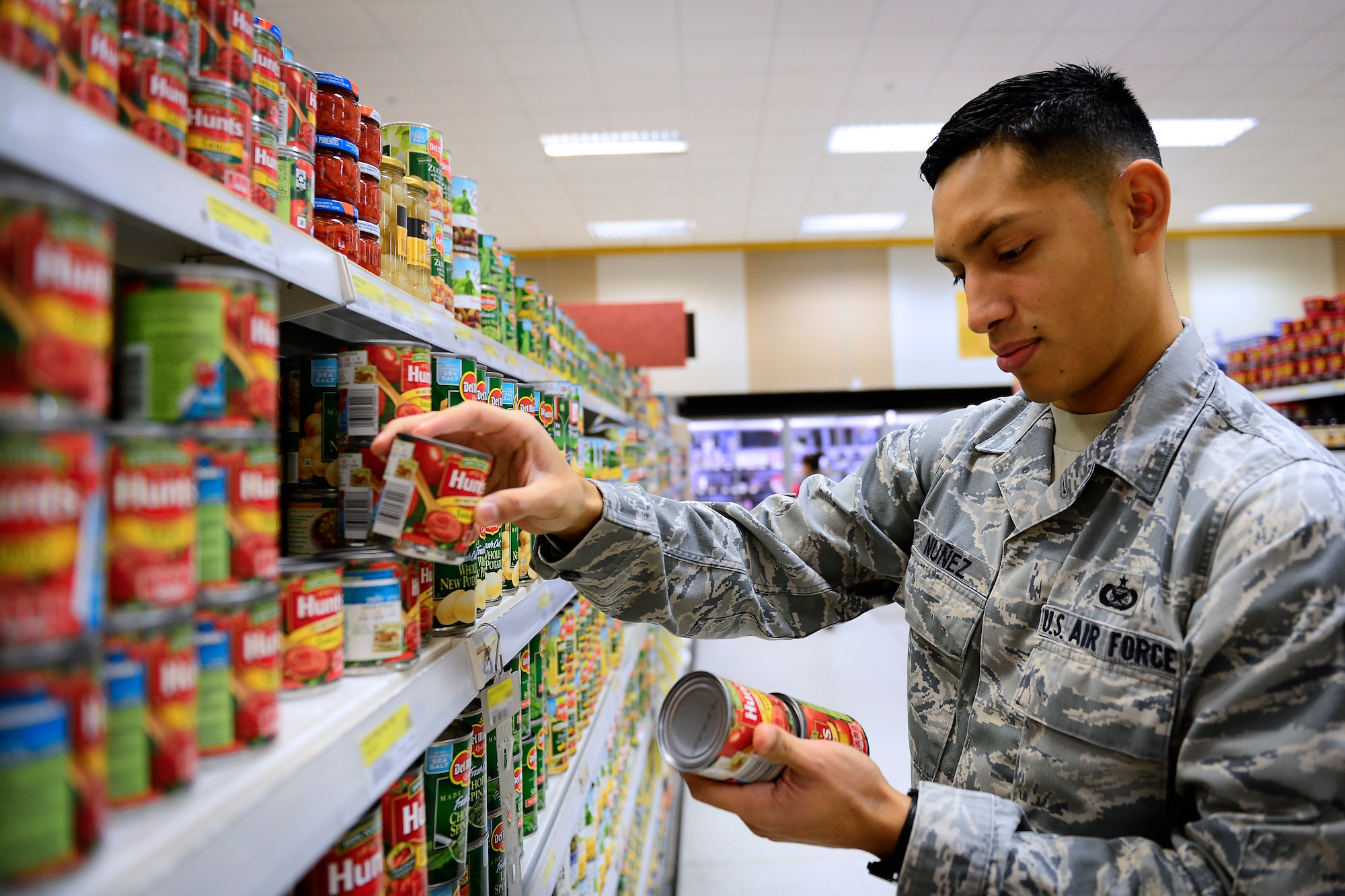 Military personnel save an average of 30 percent or more shopping at the commissary at Royal Air Force Lakenheath, England, Dec. 7, 2015. With almost 20 new employees, the new staff help to keep the products rotated and fresh for customers. (U.S. Air Force photo by Airman 1st Class Erin R. Babis/Released)