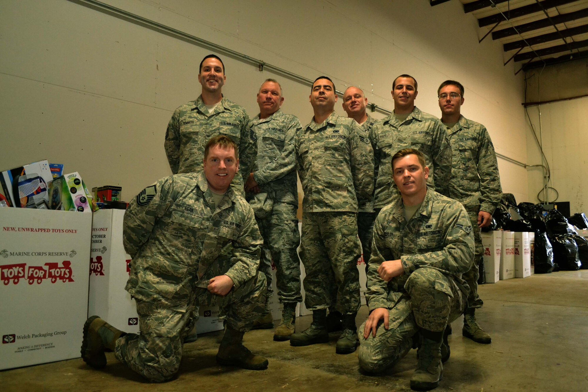 Members of the 111th Logistics Readiness Squadron at Horsham Air Guard Station, Pennsylvania, stop to take a group photo before beginning work Dec. 22, 2015 at the Toys For Tots warehouse in Glenside, Pennsylvania. The team helped overwhelmed volunteers sort, count and package more than 1,000 donated items.(U.S. Air National Guard photo by Tech. Sgt. Andria Allmond)