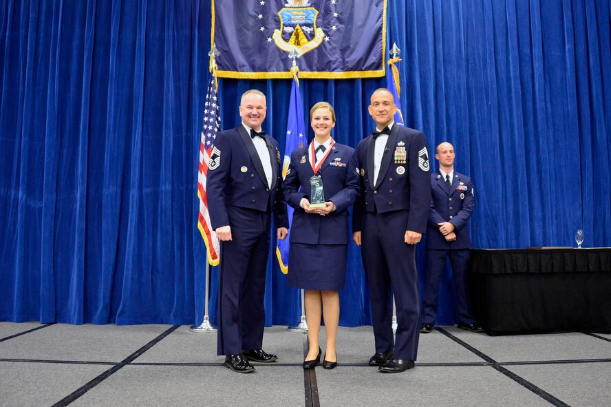 MCGHEE TYSON AIR NATIONAL GUARD BASE, Tenn. -  Senior Airman Jorrie Hart, receives the Commandant Leadership Award  for Airman leadership school class 16-2 from Chief Master Sgt. Kevin Thomas, Air National Guard advisor to the commander, Thomas N. Barnes Center for Enlisted Education, and Chief Master Sgt. Edward L. Walden, Sr., commandant of the Paul H. Lankford Enlisted PME Center, here, Dec. 17, 2015, at the I. G. Brown Training and Education Center. (U.S. Air National Guard photo by Master Sgt. Jerry D. Harlan/Released)