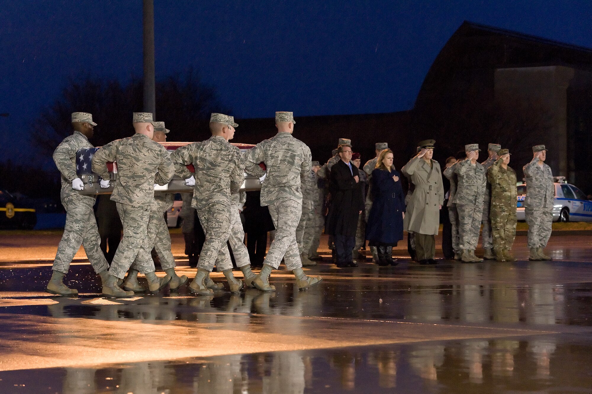 A U.S. Air Force carry team transfers the remains of Staff Sgt. Chester J. McBride, of Statesboro, Ga., during a dignified transfer Dec. 23, 2015, at New Castle Air National Guard Base, New Castle, Del. McBride was assigned to the Air Force Office of Special Investigations, Detachment 405, Maxwell Air Force Base, Ala. (U.S. Air Force photo/Roland Balik)