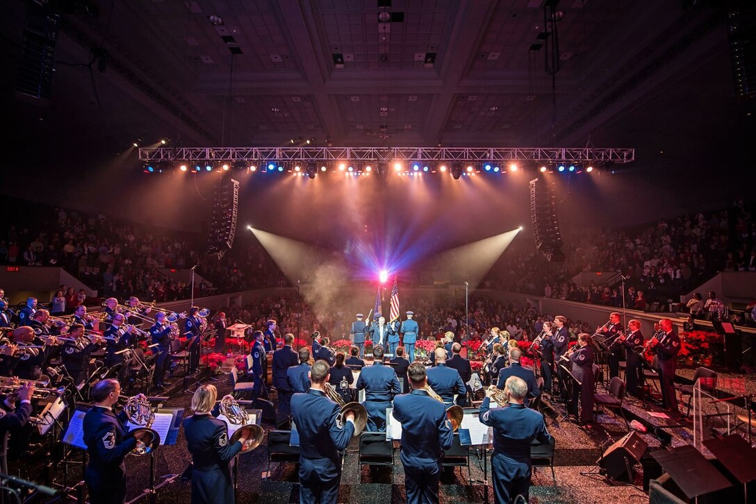 Col. Larry Lang conducts The U.S. Air Force Band along with the U.S. Air Force Honor Guard Color Team during the national anthem at the opening of the final holiday concert at DAR Constitution Hall in Washington D.C., Dec. 18, 2015. (U.S. Air Force photo/Senior Master Sgt. Kevin Burns)