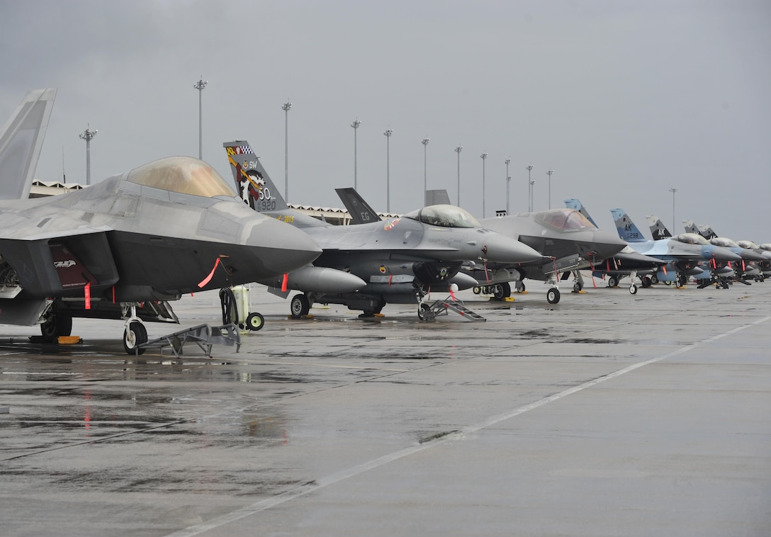 An F-22 Raptor, a T-38 Talon, F-16 Fighting Falcons and an F-35 Lightning II sit on the flightline during the Checkered Flag 16-1 exercise on Tyndall Air Force Base, Fla., Dec. 17, 2015. U.S. Air Force photo by Senior Airman Sergio A. Gamboa
