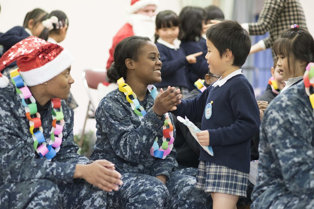 U.S. sailors visit a school near Commander Fleet Activities Sasebo, Japan, Dec. 21, 2015. The sailors are assigned to the USS Bonhomme Richard. U.S. Navy photo by Petty Officer 1st Class James Mitchell