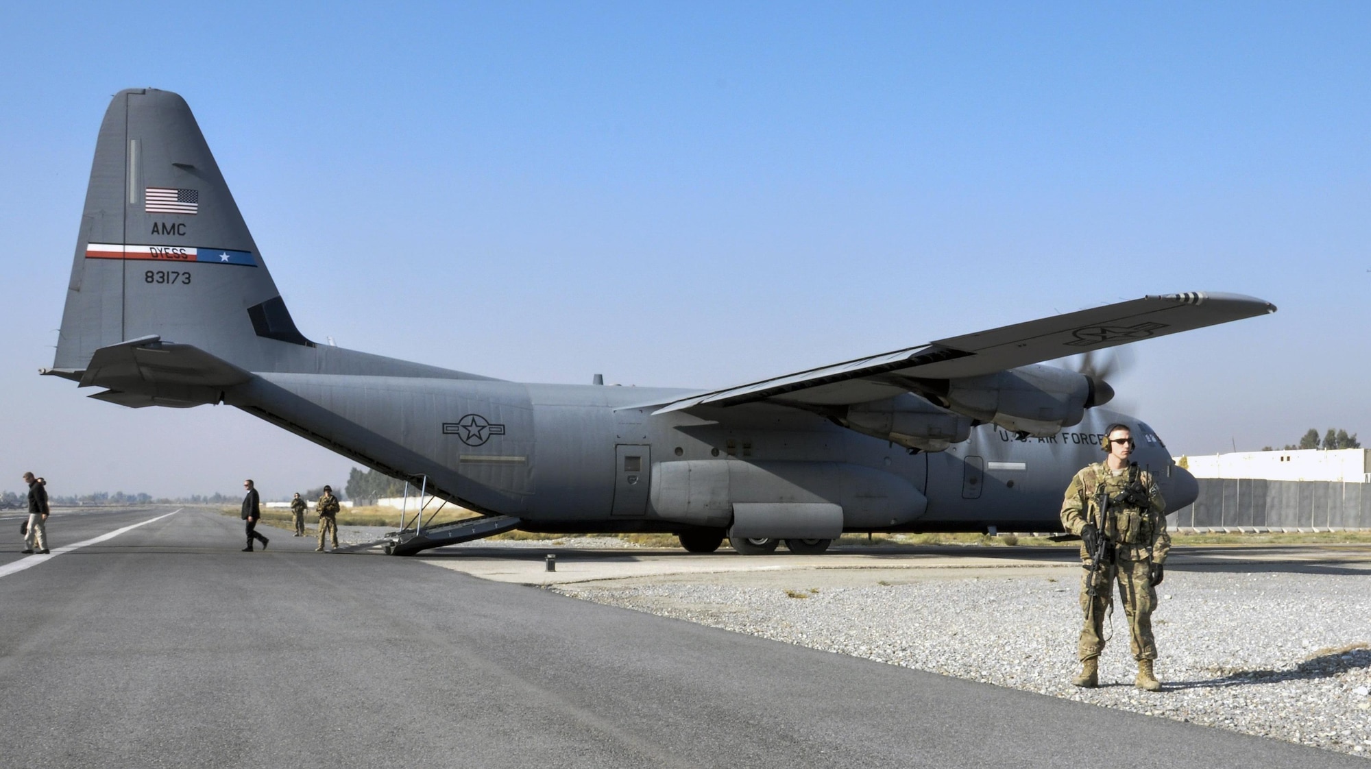 Staff Sgt. Tyler Berogan, 455th Expeditionary Security Forces Squadron Fly Away Security Team squad lead, right, secures the flightline with his team at Jalalabad Airfield, Afghanistan Dec. 18, 2015.  The 455th ESFS FAST is the all-encompassing security team that provides ground safety and cockpit denial to protect the aircraft and crew. (U.S. Air Force photo by Tech. Sgt. Nicholas Rau)