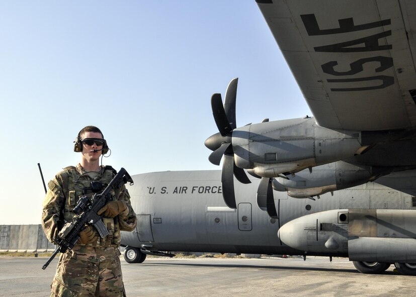 Airman 1st Class Seth Seward, 455th Expeditionary Security Forces Squadron Fly Away Security Team Defender, provides half of the 360 degree security to a C-130 Hercules during a mission to Jalalabad Airfield, Afghanistan Dec. 18, 2015.  The 455th ESFS FAST is the all-encompassing security team that provides ground safety and cockpit denial to protect the aircraft and crew. (U.S. Air Force photo by Tech. Sgt. Nicholas Rau)