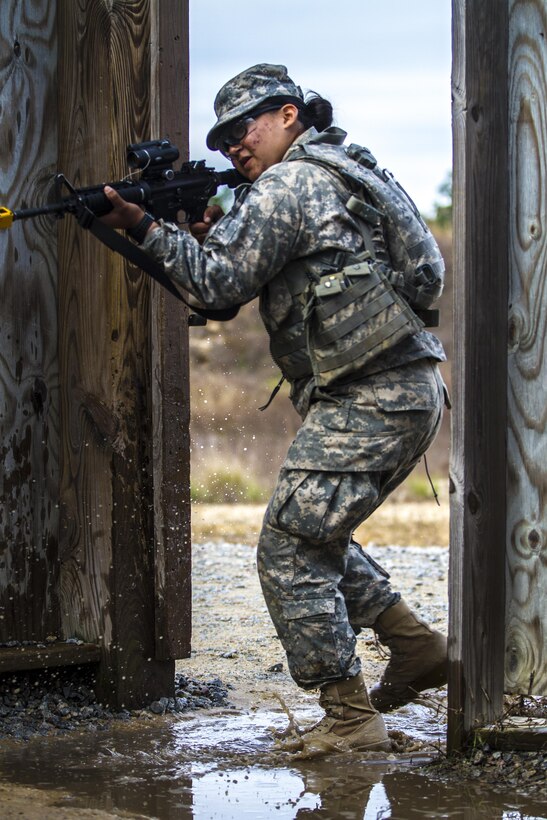 A Soldier in basic combat training with B Company, 2nd Battalion, 39th Infantry Regiment enters a room while rehearsing building clearance procedures at the Urban Assault Course located on Fort Jackson, S.C., Dec. 3, 2015. (U.S. Army photo by Sgt. 1st Class Brian Hamilton)