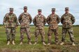 Master Sgt. Russell Moore, second from left, and Capt. Kirk Freeman, middle, won the U.S. Army Forces Command Weapons Marksmanship Competition, Sept. 23, 2015, at Fort Bragg, N.C. Moore, Freeman, and Sgt. Ben Mercer, second from right, are members of the U.S. Army Reserve Marksmanship Team. Moore won the M9 pistol category, Freeman won the M4 rifle category and Mercer finished in the top for in M249 Squad Automatic Weapon. Also pictured are Brig. Gen. Michael J. Warmack, U.S. Army Reserve Command deputy chief of staff for the G-3/5/7. The three-day FORSCOM competition featured 27 marksmen from the U.S. Army, U.S. Army Reserve, and the National Guard in events for the M9 pistol, the M4A1 rifle and the M249 SAW, or Squad Automatic Weapon, to recognize Soldiers who are beyond expert marksmen. The multi-tiered events challenged the competitors' ability to accurately and quickly engage targets in a variety of conditions and environments. (U.S. Army photo by Timothy L. Hale/Released)