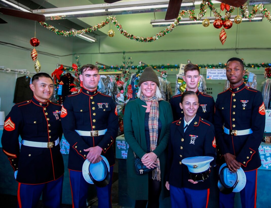 Marines pose for a picture with a local business owner before collecting toys and donations for the Toys for Tots program throughout Southern California, Dec. 18, 2015. Maj. Bill Hendricks, United States Marine Corps Reserve, started the Toys for Tots program in 1947, and it has since gone on to collect more than 500 million toys for underprivileged children during the holidays. The Marines are with 7th Engineer Support Battalion, 1st Marine Logistics Group, I Marine Expeditionary Force. (U.S. Marine Corps Photo by Pvt. Robert Bliss)