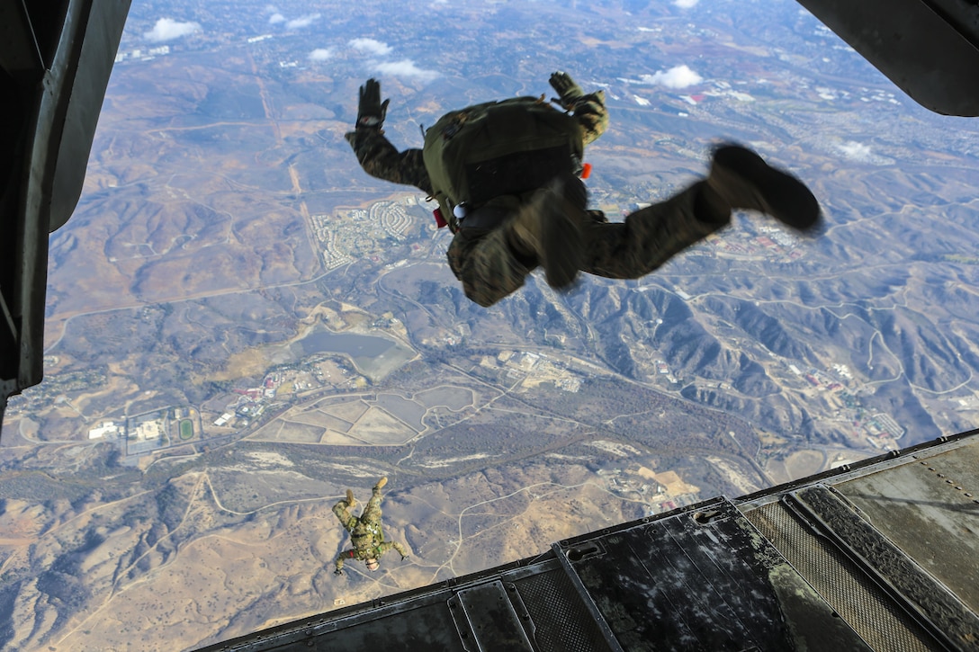Marines free fall at 10,000 feet above Basilone drop zone on Marine Corps Base Camp Pendleton, Calif., Dec. 21. The training enables the Marines to be ready to deploy at a moment’s notice. U.S. Marine Corps photo by Lance Cpl. Harley Robinson