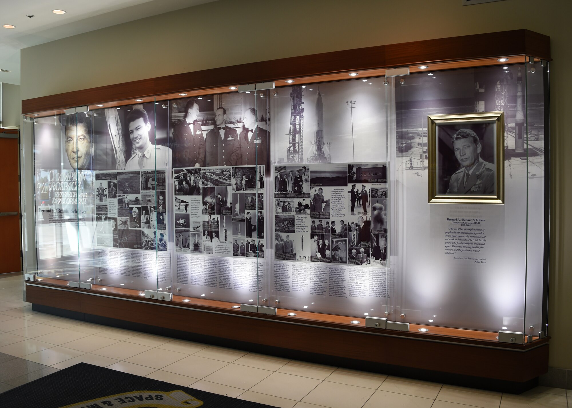 A new SMC History Office heritage display case was recently installed in the lobby of Bldg. 270 of the Space and Missile Systems Center at Los Angeles Air Force Base in El Segundo, Calif. The display depicts milestone events in the life of Gen. Bernard A. Schreiver, the legendary Architect of Air Force space and missile programs. (U.S. Air Force Photo/Joseph Juarez, Sr.)