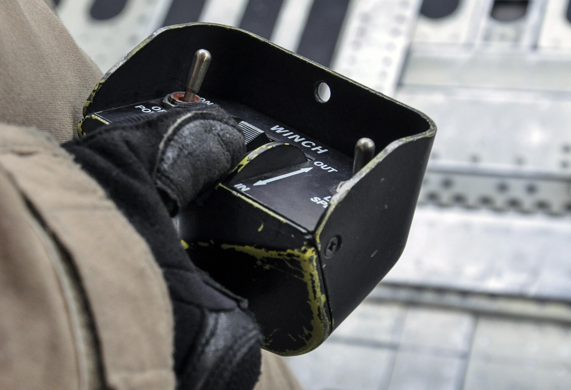 Airman 1st Class Anthony Green, 9th Airlift Squadron, Dover Air Force Base, Del., operates a winch during the unloading of a helicopter from a C-5M Super Galaxy at Bagram Airfield, Afghanistan Dec. 26, 2015. The C-5M is the largest military transport aircraft in the world, capable of hauling 270,000 pounds of cargo. (U.S. Air Force photo by Tech. Sgt. Nicholas Rau)