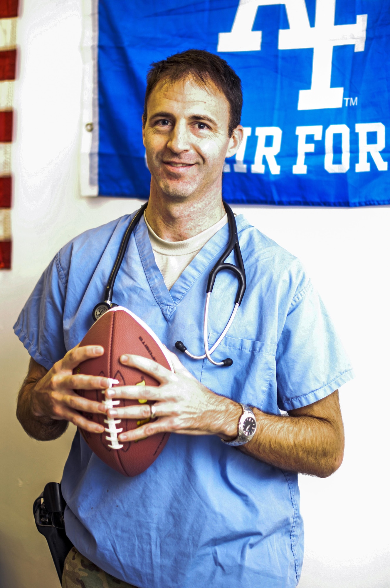 Maj. Cale Bonds, 455th Expeditionary Medical Group, poses for a picture in his office at the Craig Joint Theater Hospital on Bagram Airfield, Afghanistan Dec. 27, 2015. Bonds, a former starting quaterback for the Air Force Academy Falcons football team, is now a deployed orthopedic surgeon. (U.S. Air Force photo by Tech. Sgt. Nicholas Rau)