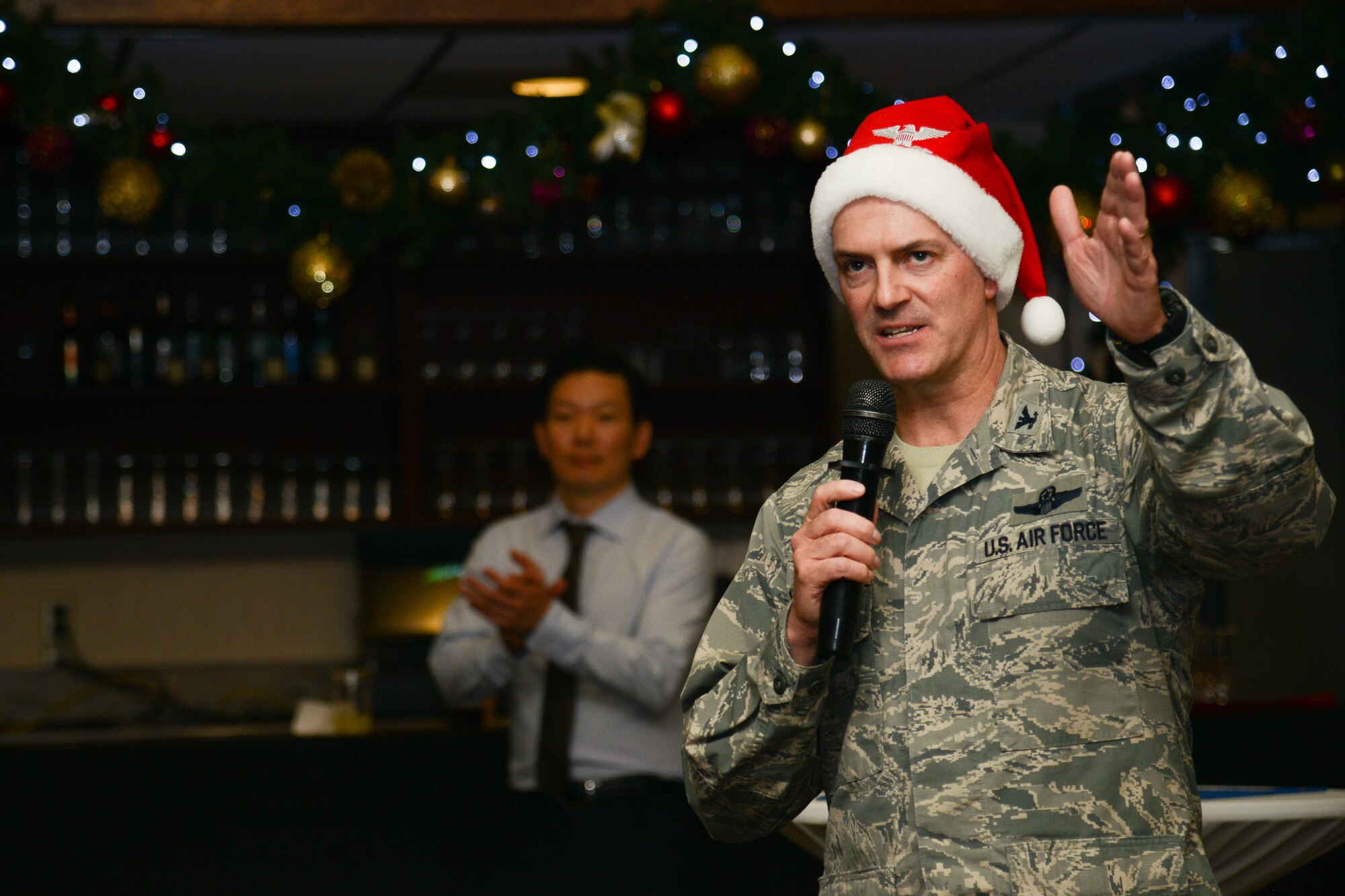 Col. Andrew Hansen, 51st Fighter Wing commander, speaks during the 51st FW Christmas reception at Osan Air Base, Republic of Korea, Dec. 23, 2015. Hansen thanked Team Osan for their hard work in 2015 and wished them happy holidays. Members of Team Osan gathered during the holidays for hors d’oeuvres and social conversation. (U.S. Air Force photo/Airman 1st Class Dillian Bamman)