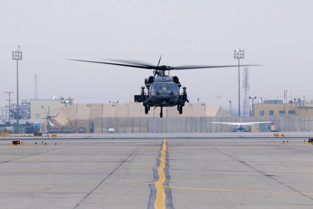 An HH-60 Pave Hawk helicopter hovers over the flightline on Bagram Airfield, Afghanistan, Dec. 26, 2015. The helicopter crew is assigned to the 83rd Expeditionary Combat Rescue Squadron. U.S. Air Force photo by Tech. Sgt. Robert Cloys