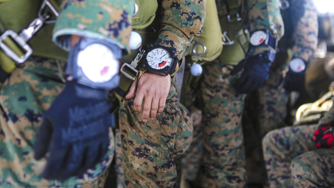 Marines with the 1st Expeditionary Operations Training Group use altimeters to measure altitude before a free fall jump at 10,000 feet above Drop Zone Basilone, Marine Corps Base Camp Pendleton, California, Dec. 21. Marine Heavy Helicopter Squadron 462 supported the 1st EOTG in their parachute-operations training. This training is intended to improve the Marines’ skill for future uses of this knowledge, such as a deployment situation. Units like the 1st EOTG deploy often and this training allows the Marines to be ready to deploy at a moment’s notice.