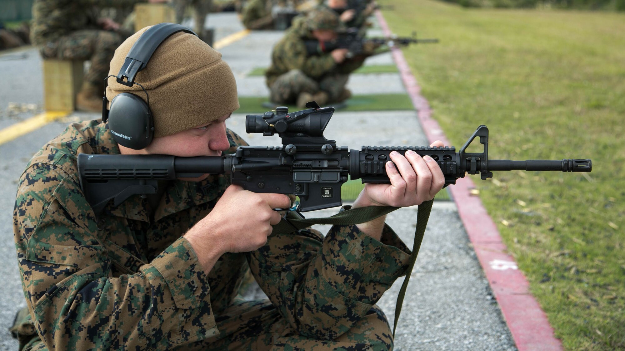 Cpl. James R. Beck, a Fixed-Wing Aircraft Power Plants Mechanic from Marine Corps Air Station Iwakuni, fires on his target during the Far East Division Marksmanship Match Dec. 17 aboard Camp Hansen, Okinawa, Japan. The shots were fired from various shooting positions and distances. Only Marines stationed throughout Japan competed in the match.