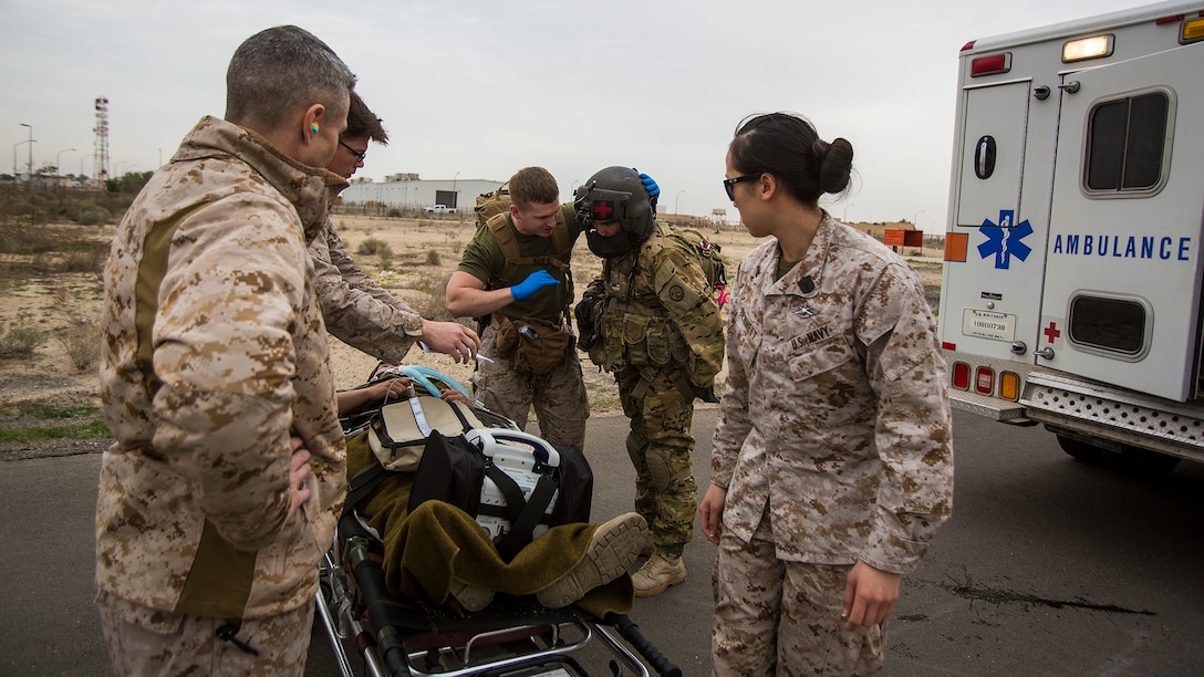 U.S. Navy and Army medical personnel prepare to load a simulated casualty onto a UH-60 “Black Hawk” helicopter during a mass casualty exercise at an undisclosed location in Southwest Asia, Dec. 23, 2015. Canadian forces, U.S. Air Force and Army medical personnel, along with U.S. Marines and Navy corpsmen with Special Purpose Marine Air Ground Task Force – Crisis Response – Central Command, participated in the joint exercise to hone the coalition’s medical response capabilities.  SPMAGTF-CR-CC is currently deployed to the U.S. Central Command area of responsibility with a mission spanning 20 nations.