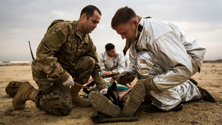 U.S. Air Force medical personnel perform initial triage on a simulated casualty during a mass casualty exercise at an undisclosed location in Southwest Asia, Dec. 23, 2015. Canadian forces, U.S. Air Force and Army medical personnel, along with U.S. Marines and Navy corpsmen with Special Purpose Marine Air Ground Task Force – Crisis Response – Central Command, participated in the joint exercise to hone the coalition’s medical response capabilities.  SPMAGTF-CR-CC is currently deployed to the U.S. Central Command area of responsibility with a mission spanning 20 nations. 