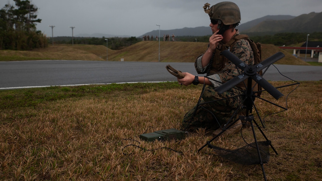 Lance Cpl. Loren Cluff sets up satellite communications for Marines with Maritime Raid Force, 31st Marine Expeditionary Unit, while they conduct a raid Dec. 10, 2015, on Camp Hansen, Okinawa, Japan. The raid was part of Interoperability Exercise 16-1, an exercise used to build a working bond between the MRF and the rest of the MEU quickly and effectively. Cluff, from Snowflake, Arizona, is a field radio operator with the Air Naval Gunfire Liaison Company Detachment, 31st Marine Expeditionary Unit. 