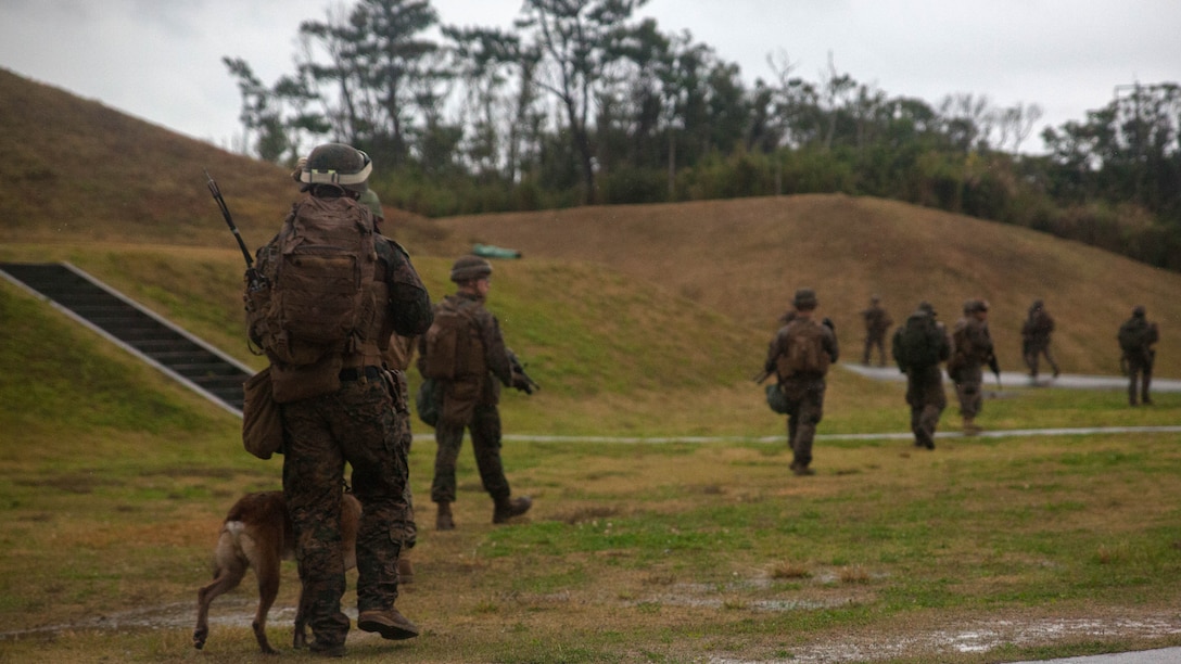 Marines with Maritime Raid Force, 31st Marine Expeditionary Unit, leave from their objective after a raid Dec. 10, 2015 on Camp Hansen, Okinawa, Japan. The raid was part of the Interoperability Exercise 16-1. INTEROP is the first opportunity the Force Reconnaissance Platoon, Amphibious Reconnaissance Platoon, and the rifle platoon from the MEU's Battalion Landing Team have to combine as the MRF with the 31st MEU.