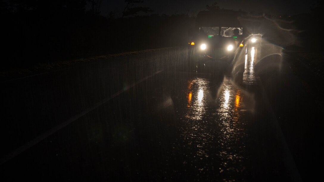 Marines with Maritime Raid Force, 31st Marine Expeditionary Unit, drive to Combat Town on, Camp Hansen, Okinawa, Japan, to conduct to a raid Dec. 14, 2015. The raid was part of the MRF’s Interoperability Exercise 16-1. INTEROP brings together all of the elements of the MRF and the MEU so they can identify any deficiencies, work through them, and build standard operating procedures. 