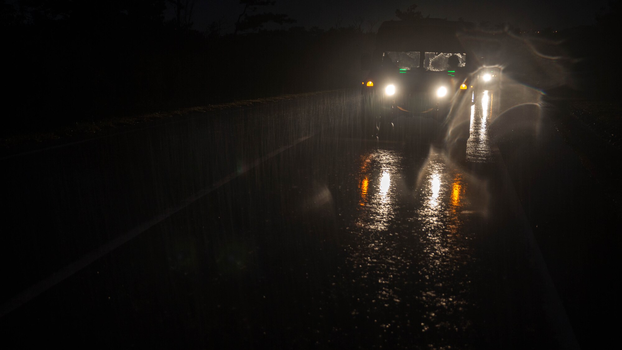 Marines with Maritime Raid Force, 31st Marine Expeditionary Unit, drive to Combat Town on, Camp Hansen, Okinawa, Japan, to conduct to a raid Dec. 14, 2015. The raid was part of the MRF’s Interoperability Exercise 16-1. INTEROP brings together all of the elements of the MRF and the MEU so they can identify any deficiencies, work through them, and build standard operating procedures. 