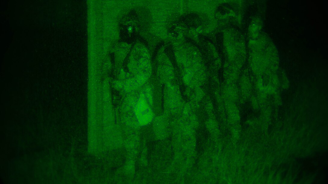 Marines with Battalion Landing Team, 1st Battalion, 5th Marines, 31st Marine Expeditionary Unit, provide security for Marines with Maritime Raid Force, 31st MEU, while they conduct a raid Dec. 14, 2015, on Camp Hansen, Okinawa, Japan. The raid is part of the MEF’s Interoperability Exercise 16-1. INTEROP is an exercise used to build a working bond between units quickly and effectively. The MRF and BLT Marines are with the 31st Marine Expeditionary Unit.