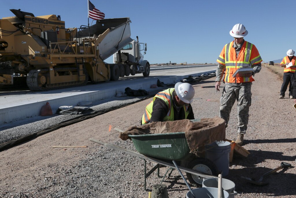 1st Lt. Luke Ritz (center), a project engineer at the District’s Fort Huachuca Resident Office, ensures that the concrete for the new apron at Libby Army Airfield meets stringent design specifications. Ritz and Harold Colby (right), a construction representative from the Tucson Resident Office, oversee several tests that confirm the concrete will properly cure for maximum strength and durability.