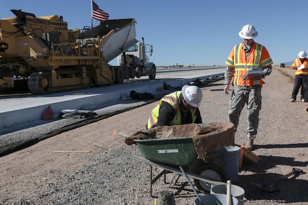1st Lt. Luke Ritz (center), a project engineer at the District’s Fort Huachuca Resident Office, ensures that the concrete for the new apron at Libby Army Airfield meets stringent design specifications. Ritz and Harold Colby (right), a construction representative from the Tucson Resident Office, oversee several tests that confirm the concrete will properly cure for maximum strength and durability.