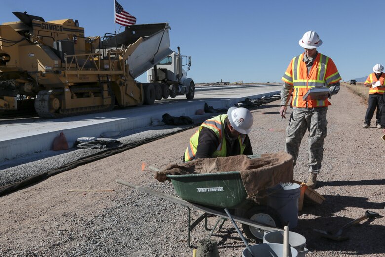 1st Lt. Luke Ritz (center), a project engineer at the District’s Fort Huachuca Resident Office, ensures that the concrete for the new apron at Libby Army Airfield meets stringent design specifications. Ritz and Harold Colby (right), a construction representative from the Tucson Resident Office, oversee several tests that confirm the concrete will properly cure for maximum strength and durability.