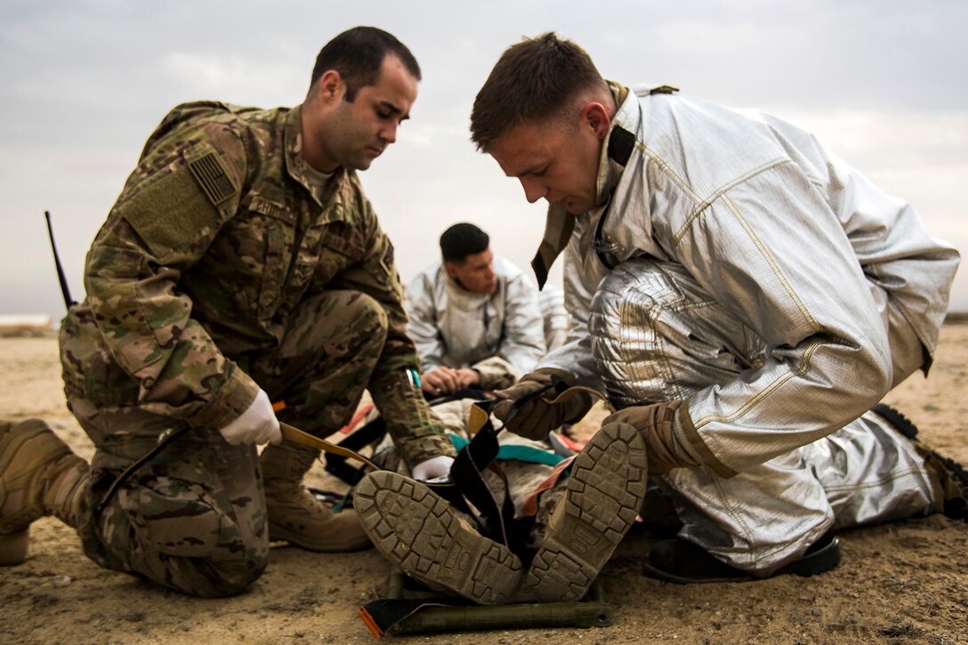 U.S. Air Force medical personnel perform initial triage on a simulated casualty during a mass casualty exercise at an undisclosed location in Southwest Asia, Dec. 23, 2015. Canadian forces, U.S. Air Force and Army medical personnel, along with U.S. Marines and Navy corpsmen participated in the joint exercise to hone the coalition’s medical response capabilities. U.S. Marine Corps photo by Sgt. Rick Hurtado 