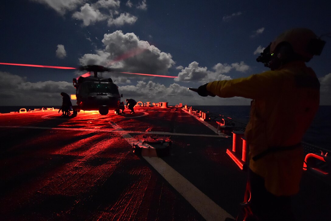 U.S. sailors aboard the USS Carney conduct night flight operations in the Mediterranean Sea, Dec. 21, 2015. The Carney is forward deployed to Rota, Spain, to conduct a routine patrol in the U. S. 6th Fleet area of operations in support of U.S. national security interests in Europe. U.S. Navy photo by Petty Officer 1st Class Theron J. Godbold