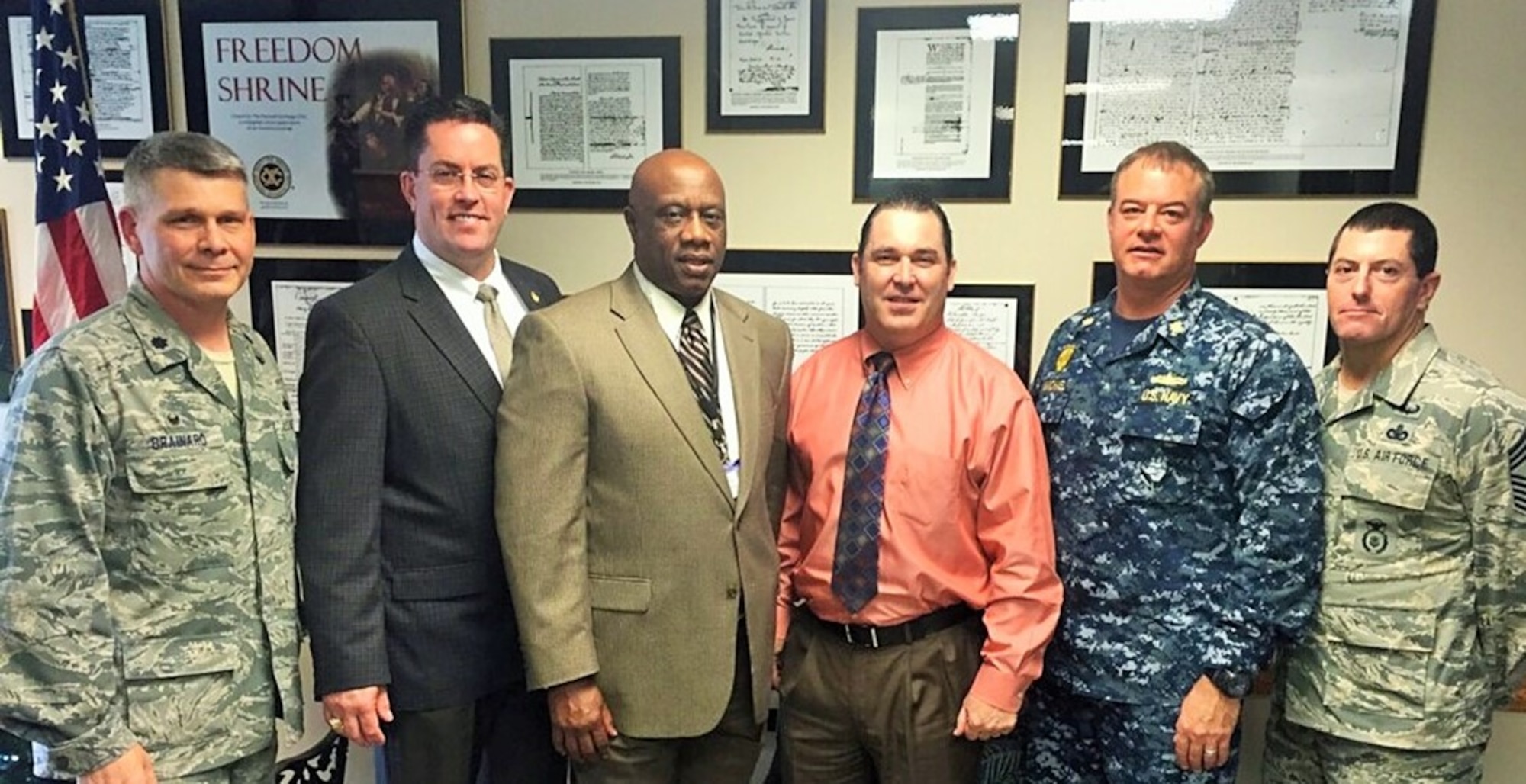JOINT BASE CHARLESTON, SC -- Leaders from the 628th Air Base Squadron stand alongside members from the North Charleston Police Department, Charleston County Sheriff and Berkley County Sheriff during a meeting on Joint Base Charleston Dec. 11, 2015. The leaders discussed crime in the local area and what military members should know to prevent becoming a victim. (Courtesy Photo)