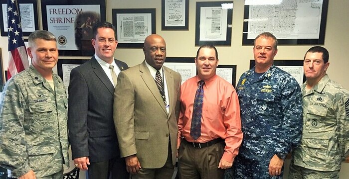JOINT BASE CHARLESTON, SC -- Leaders from the 628th Air Base Squadron stand alongside members from the North Charleston Police Department, Charleston County Sheriff and Berkley County Sheriff during a meeting on Joint Base Charleston Dec. 11, 2015. The leaders discussed crime in the local area and what military members should know to prevent becoming a victim. (Courtesy Photo)