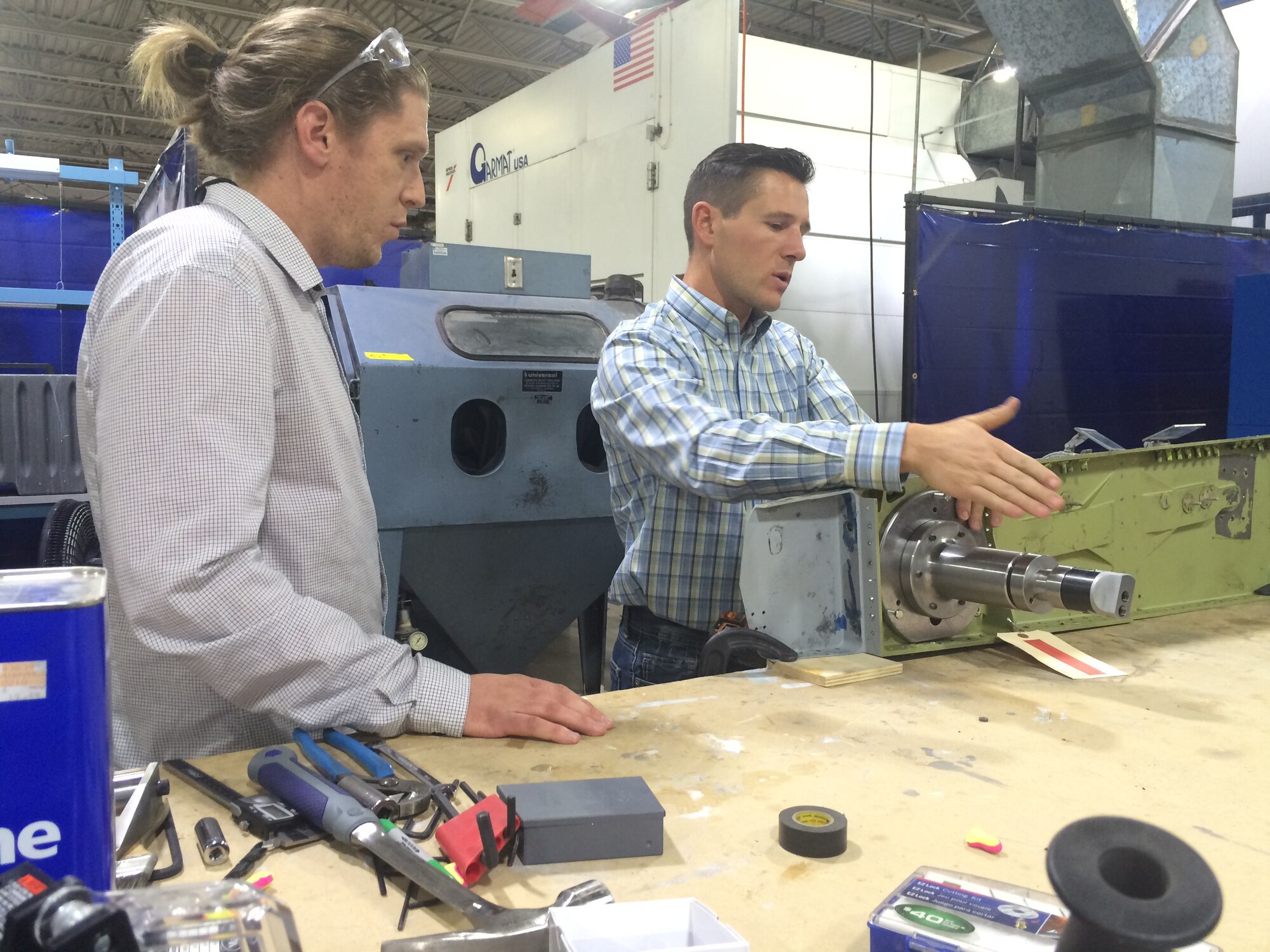 Jesse Holdaway, left, and Mike Shaw, structural engineers with the F-16 Systems Program Office, work on a tool to fix F-16 horizontal stabilizers at the Weber State University Concept Center. The Air Force Sustainment Center recently entered into a partnership with WSU to utilize their facility to produce one off prototypes that can be used in maintenance. (Air Force photo by Micah Garbarino)