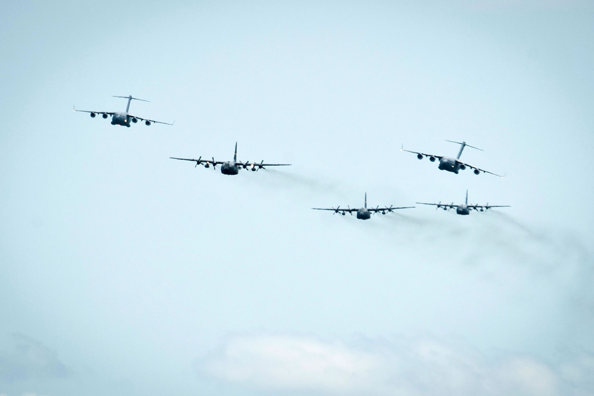 A five-ship formation flight of C-130 Hercules and C-17 Globemaster IIIs from Hawaii, Alaska and Montana fly during the multinational Southern Katipo Exercise held in New Zealand. A 120th Airlift Wing C-130 and its aircrew participated in the exercise November 2015. (Courtesy photo)