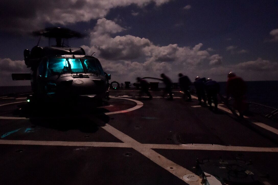 U.S. sailors aboard the USS Carney conduct night flight operations in the Mediterranean Sea, Dec. 21, 2015. U.S. Navy photo by Petty Officer 1st Class Theron J. Godbold