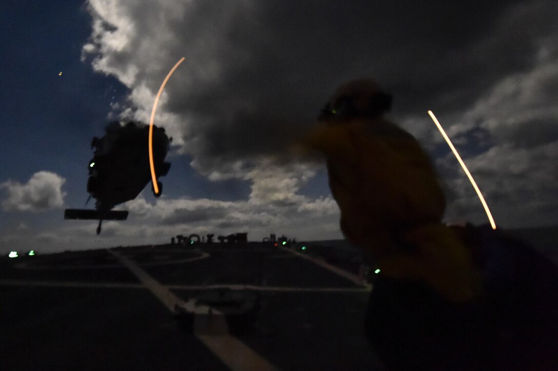 U.S. sailors aboard the USS Carney conduct night flight operations in the Mediterranean Sea, Dec. 21, 2015. U.S. Navy photo by Petty Officer 1st Class Theron J. Godbold